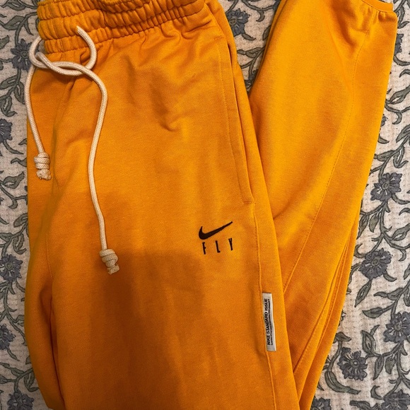Nike Fly Women's Golden Track Pants - Picture 1 of 2